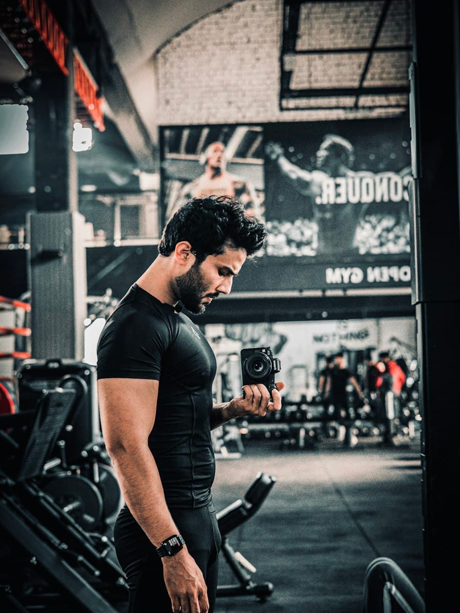 Ahmed R., online coaching client from Lahore, training with dumbbells